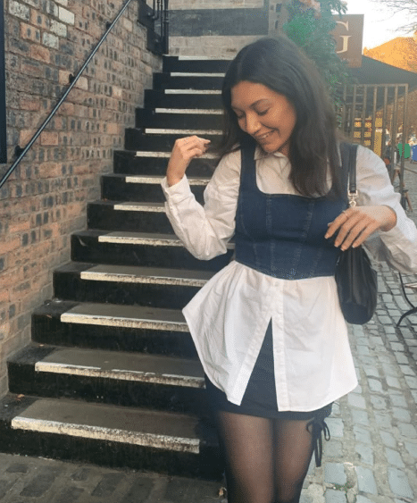 36. White Button-Up, Black Corset, and Mini Skirt