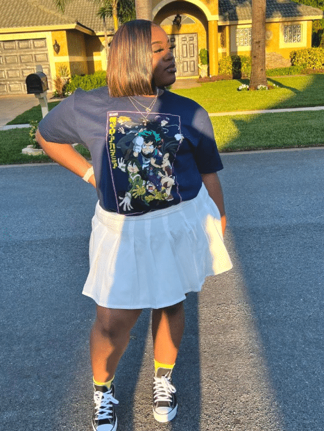 51. Graphic Tee & Pleated Mini Skirt